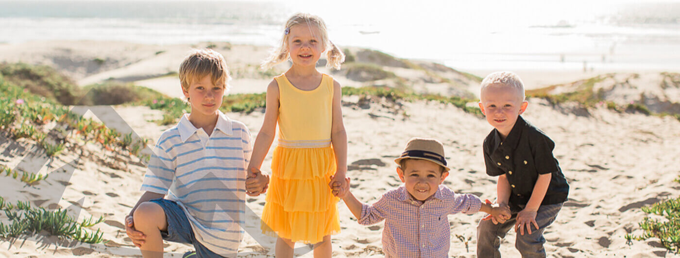 Four kids having fun on beach