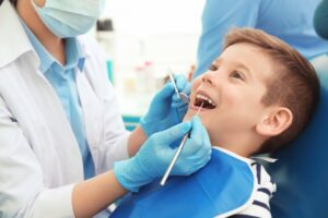 a child’s mouth being examined